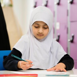 Girl writing in class