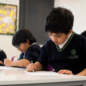 Pupils writing in class