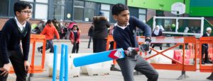 Boy playing cricket